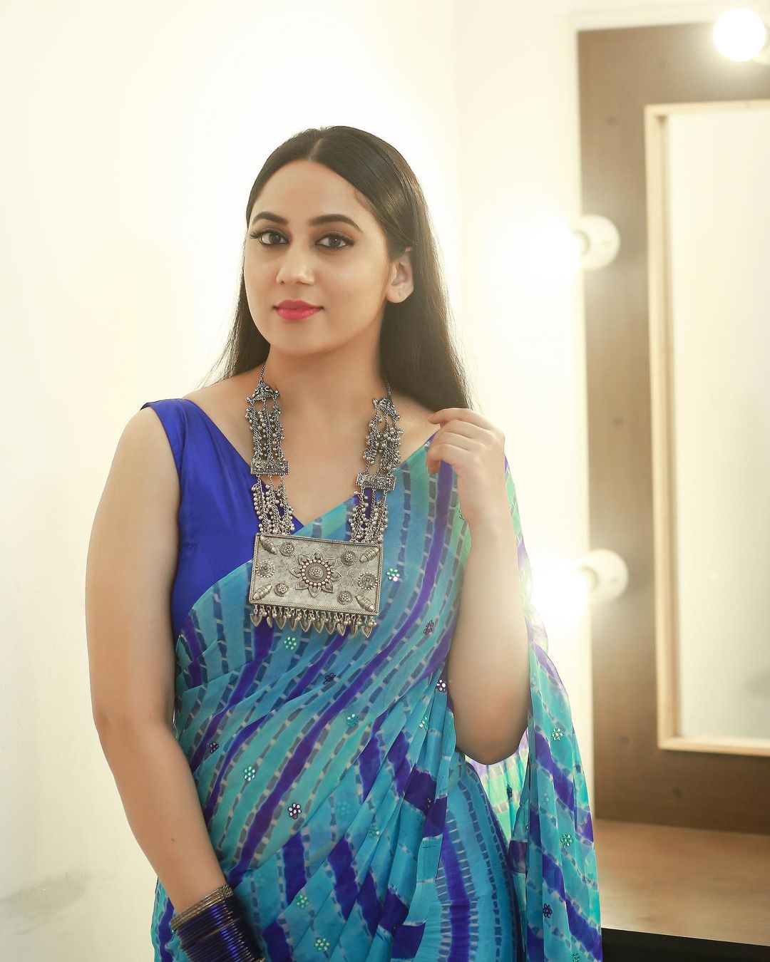 Malayalam Actress Miya George in Sleeveless Blue Saree